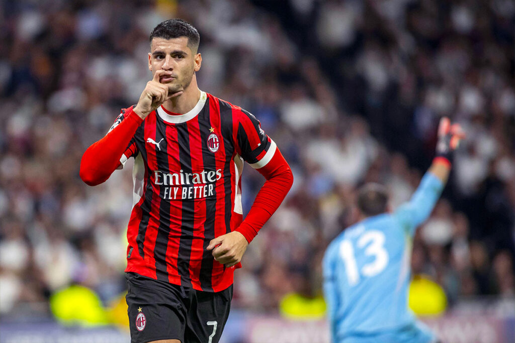 Alvaro Morata esulta con la mano al volto dopo aver segnato contro il Real Madrid in Champions League con il Milan