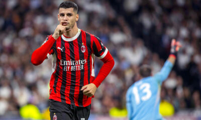Alvaro Morata esulta con la mano al volto dopo aver segnato contro il Real Madrid in Champions League con il Milan