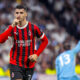 Alvaro Morata esulta con la mano al volto dopo aver segnato contro il Real Madrid in Champions League con il Milan