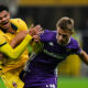 Contrasto tra Athekame del Milan e Nicolussi Caviglia della Fiorentina durante la partita a San Siro.